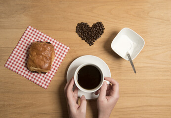 Coffee with a chocolate croissant in a café  setting 