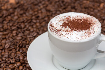 cup of cappuccino with coffee beans