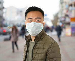 Ill man wearing mask isolated on white