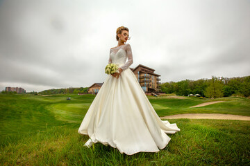 Young sexy bride in luxury wedding dress