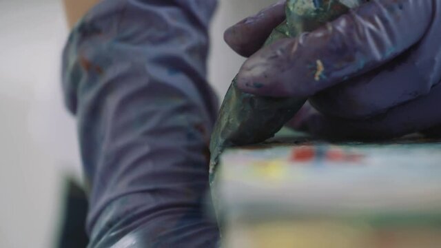 Squeezing paint out of a tube