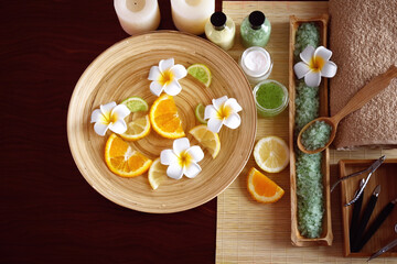 Beautiful spa composition of manicure tools and plate on wooden background