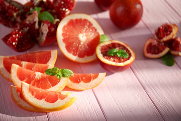 Beautiful composition with citrus fruits on wooden background