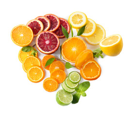 Slices of delicious citrus fruits on white background