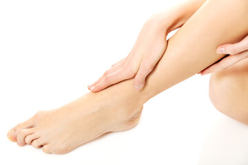 Women's feet on white background.