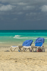 Sunbeds on tropical beach in island Cayo Santa María. Cuba