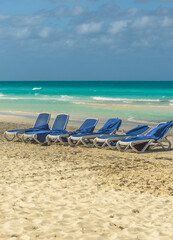 Sunbeds on tropical beach in island Cayo Santa María. Cuba