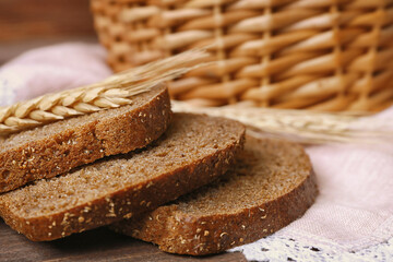 Delicious sliced rye bread on table, closeup