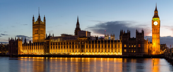 Naklejka na ściany i meble Panorama of Big Ben and House of Parliament at River Thames International Landmark of London England United Kingdom at Dusk