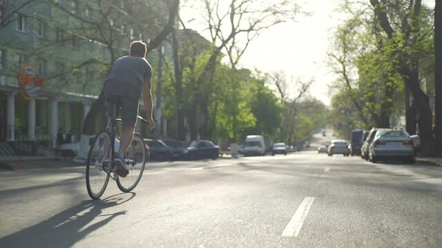Man riding his bike and drifting on the street slow motion