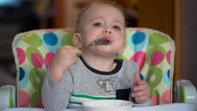 The Kid Eats With a Spoon Porridge