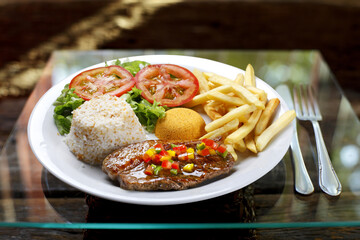 Grilled meat with trimmings