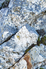 gray white-colored beautiful stones, rocks with moss, close-up, nature, texture