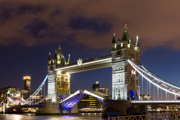 Fototapeta na wymiar Tower Bridge with reflections at sunset in London, UK.