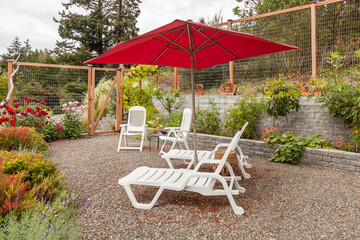 chaise lounges and patio furniture in private garden