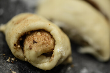 Fototapeta Dough rolling for cinnamon rolls. Close-up. Selective focus obraz