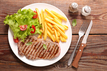 grilled beef steak and french fries