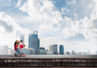 Concept of careless happy childhood with girl of school age looking in future