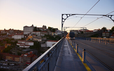 Naklejka na ściany i meble Ponte Dom Luís I during sunset with yellow metro trams - Porto, Portugal