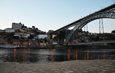 Ponte Dom Lu&iacute;s I during sunset, with water reflections - Porto, Portugal