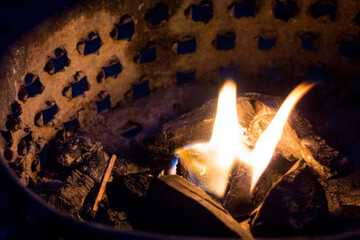 closeup view of brazier with match