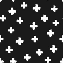 Naklejka premium White crosses isolated on a black background. Drawn by hand with a rough brush.
