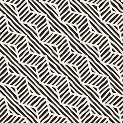 Vector seamless hand drawn pattern. Zigzag and stripe rough lines. Tribal design background. Ethnic doodle texture.