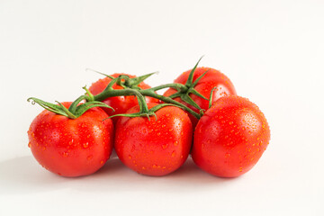 Red fresh tomatoes isolated on white background