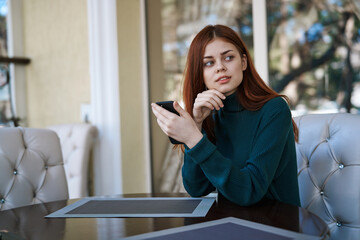 woman on the veranda with phone