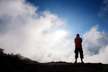 Fototapeta na wymiar Tourist hiking in Haleakala volcano crater on the Sliding Sands trail.