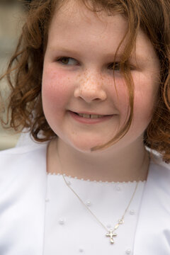 VILLANOVA, PA - MAY 14: Young Girl Dressed Up Receiving Her First Holy Communion At St. Thomas Of Villanova Church