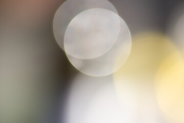 abstract soft yellow and white bokeh light circles background