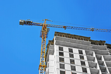 Crane and highrise construction site