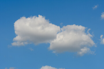 Two clouds on the blue sky, backgrownd