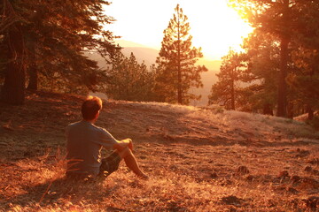 man looking at sunset