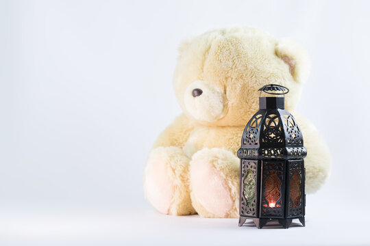 Teddy Bear with lantern on  a white background