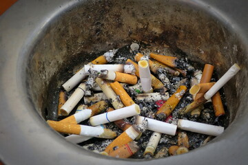 Cigarettes in ashtray . World no tobacco day on may 31. Selective focus.