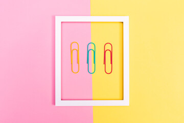 Big paper clips on a vibrant background