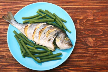 Grilled sea bream fish with green beans