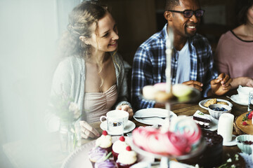 Friends Gathering Together on Tea Party Eating Cakes Enjoyment happiness