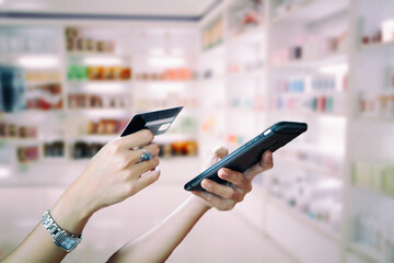 woman asian using smart phone and credit card shopping online , selective focus on hand