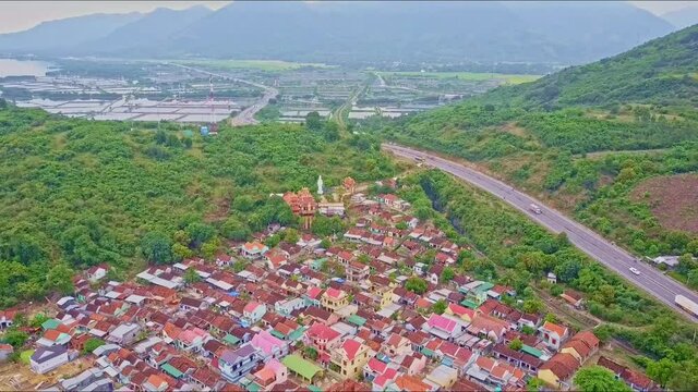 Aerial View over Road and Nice Baho Town against River