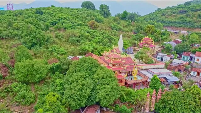 Flycam Moves above Beautiful Buddhist Temple in Town