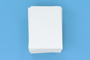 Stack of blank white closed brochure mock-up on blue background