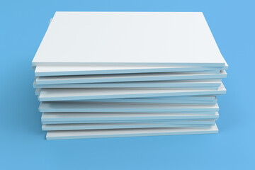 Stack of blank white closed brochure mock-up on blue background