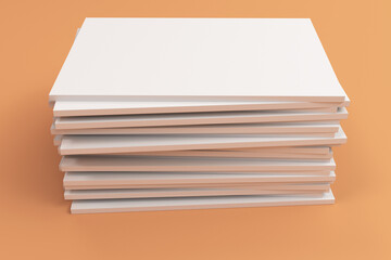 Stack of blank white closed brochure mock-up on orange background