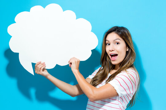 Young Woman Holding A Speech Bubble