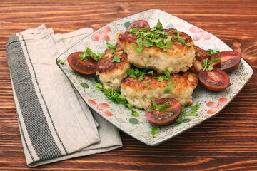 Chicken cutlets on wooden background