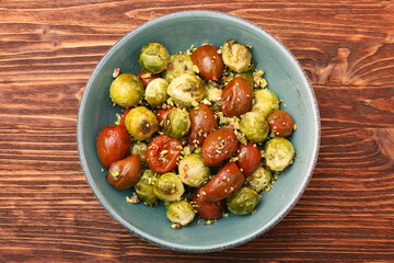 Oven baked brussels sprouts and tomatoes with pistachios