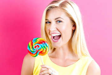 Young woman holding a lollipop